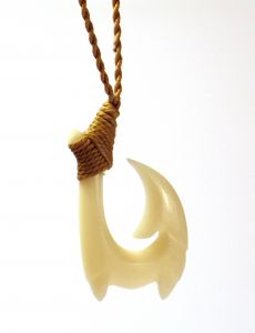 Necklace of a carving that looks like a fish hook